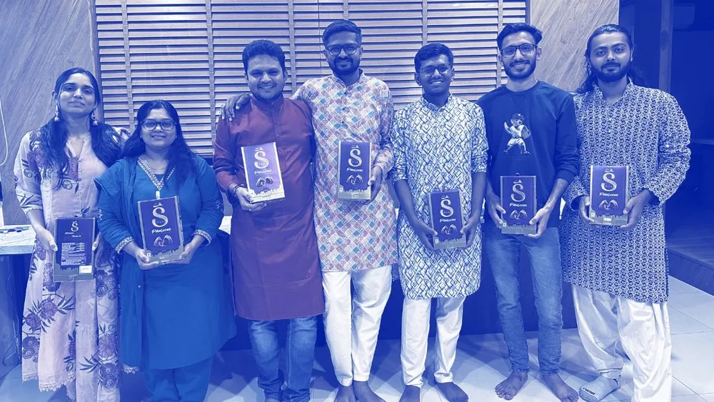 Heliconia team members at an awards evening, holding their awards