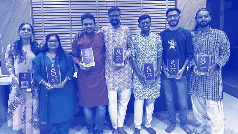 Heliconia team members at an awards evening, holding their awards