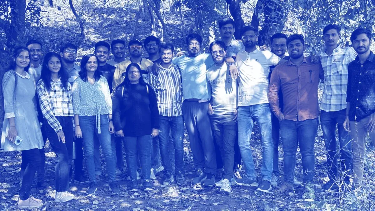 The Heliconia Solutions team standing together outdoors